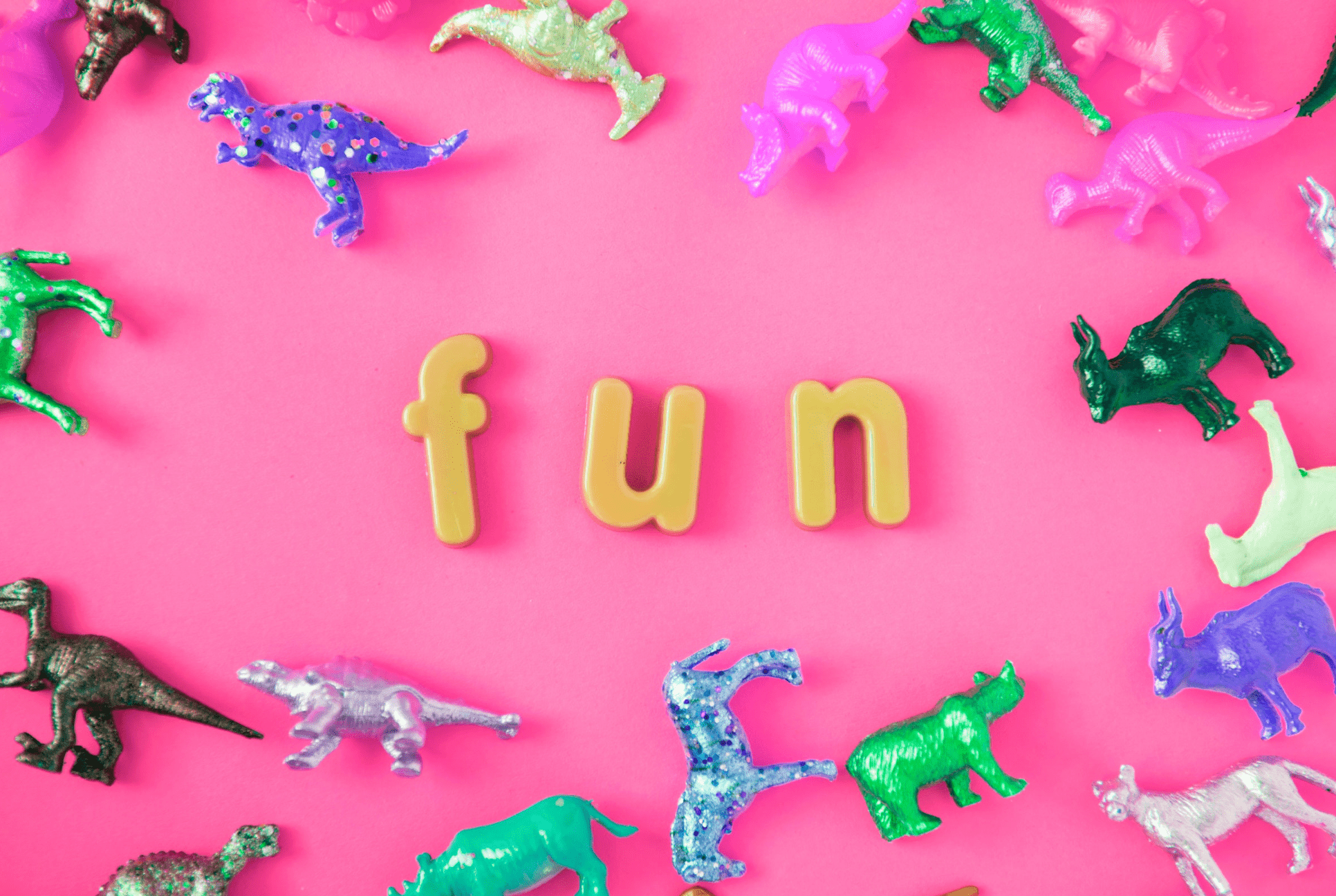 pink background with FUN spelled out surrounded by toys fun indoor activities