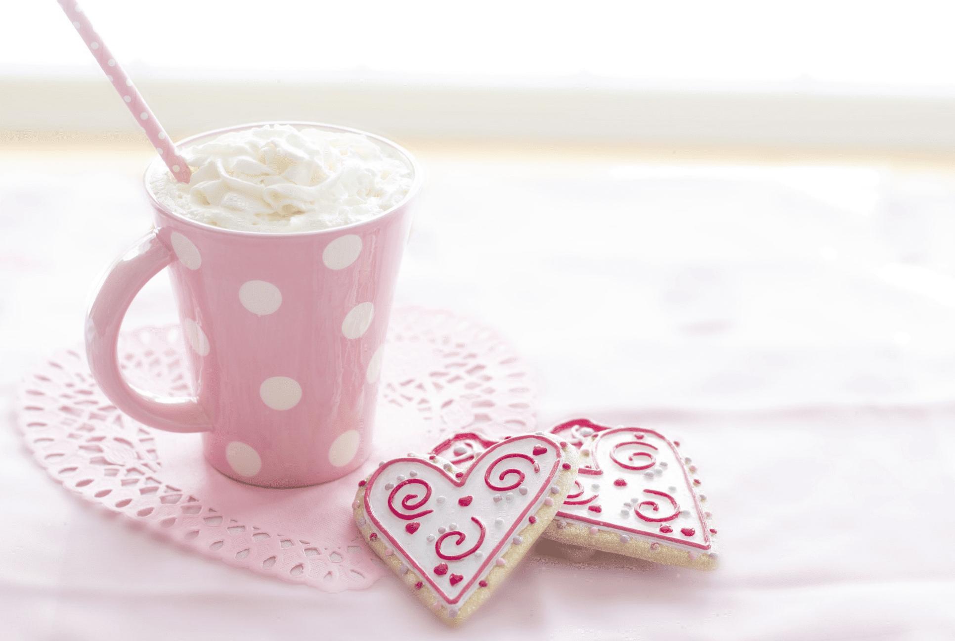 pink mug and heart shaped cookies for Valentine's Day