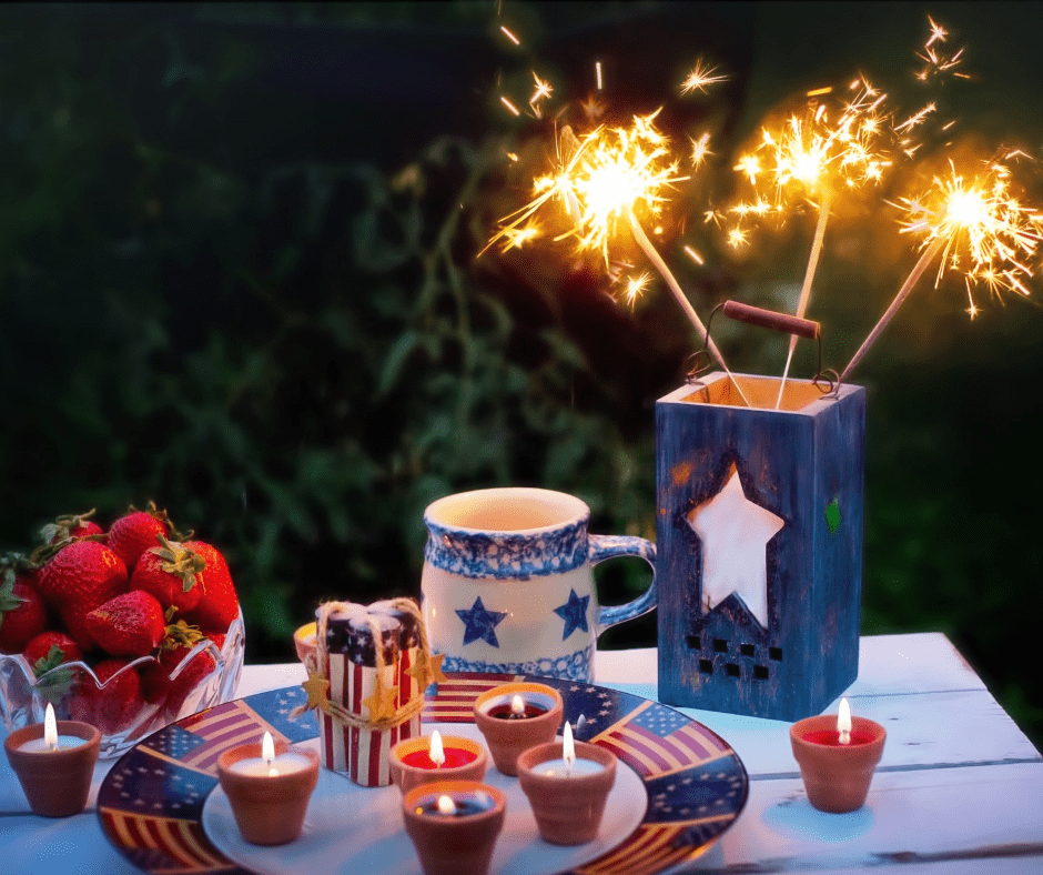 table full of red white and blue decor including sparklers