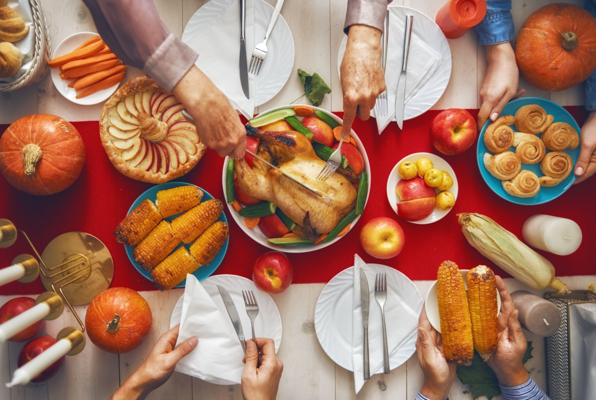 red table cloth set with Thanksgiving dinner