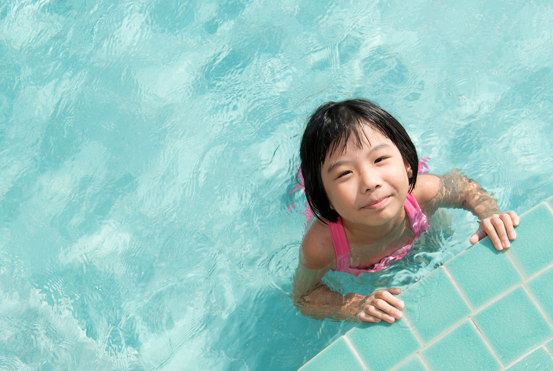 young girl in pool